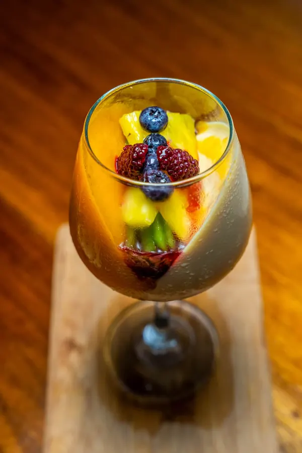 A fruit dessert served in a glass